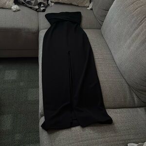 Elegant black gown lovely slit down the middle bow tie back